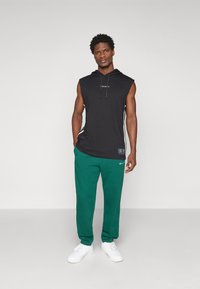 Champion ICONS CUFF PANTS - Jogginghose - dark green
