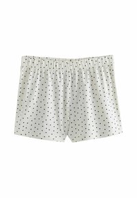 White cotton shorts with a black heart pattern, elastic waistband, and a relaxed fit. Soft texture with a smooth finish.