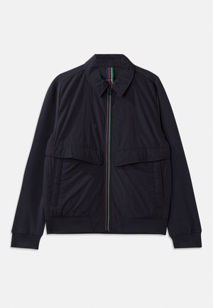Navy jacket featuring a zip front with a multicolored striped placket, two large front pockets, and a ribbed hem. Textured fabric finish.