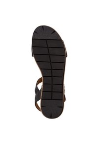 Black sandal with a textured rubber sole featuring transverse grooves for grip, a brown leather accent, and an open-back design.