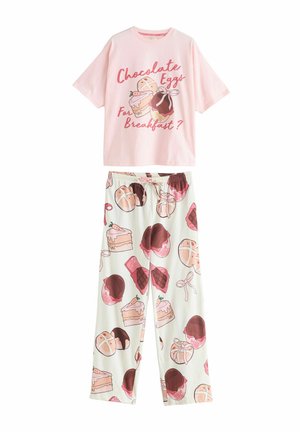 Pink cotton t-shirt featuring a graphic with text, paired with white pajama pants adorned with dessert patterns in pink and brown.