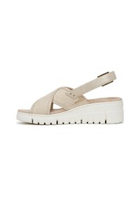 Beige wedge sandal with a fabric crossover design, adjustable ankle strap, and textured sole for grip. Lightweight and open-toe style.