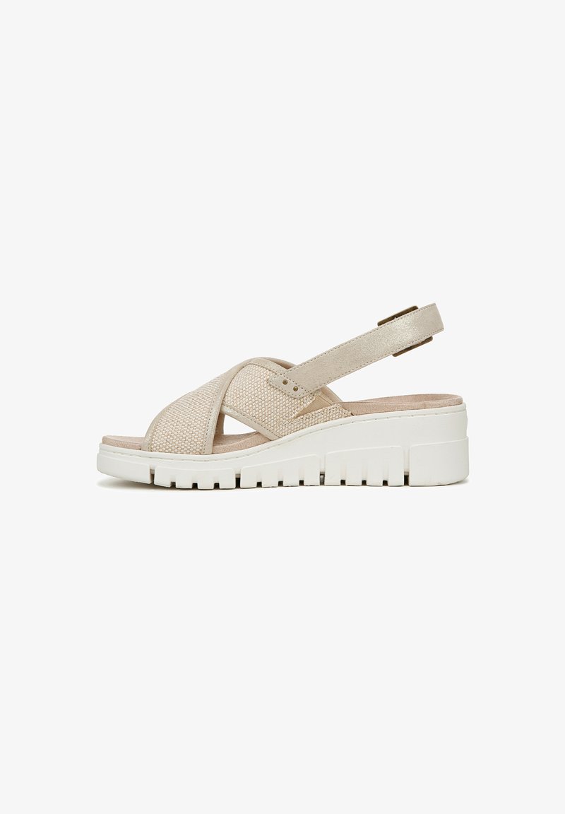 Sandal in pelle beige con design incrociato in tessuto, cinturino alla caviglia regolabile e suola testurizzata per una buona aderenza. Leggera e con punta aperta.