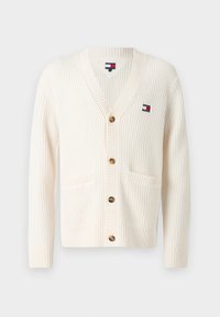 Krem cardigan laget av teksturert strikket stoff, med V-hals, knappelukking og to frontlommer. Inkluderer logo-patch.