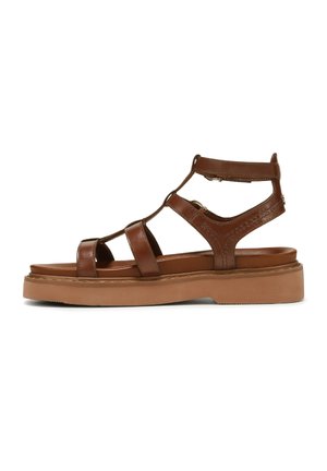 Sandalo in pelle marrone con più cinturini, una soletta imbottita e una suola spessa in gomma marrone chiaro. Dotato di fibbia laterale regolabile.