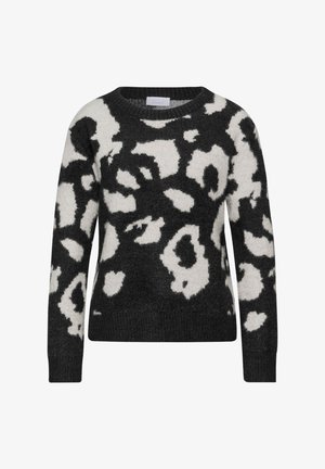 Zwart-wit gebreide trui met een ronde hals, lange mouwen, een zachte textuur en een luipaardachtig patroon verspreid over de trui.