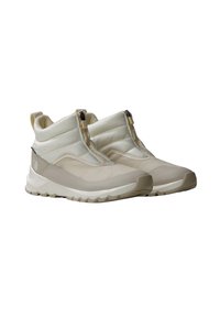 Beige høyhælte sneakers med polstret overdel, glidelås, mesh-paneler og teksturert såle. Yttersålen har et robust mønster.