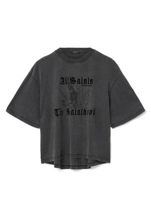 T-shirt nera oversized realizzata in morbido cotone, con scollo rotondo, maniche corte e design grafico frontale con motivo scheletro.