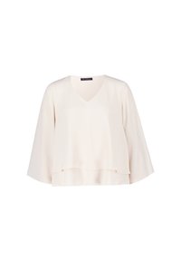 Top di crema chiaro con scollatura a V, maniche ampie e orlo a strati. Realizzato in un tessuto morbido con una silhouette leggermente drappeggiata.