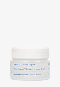 Korres Grekisk Yoghurt Smart Yoghurt™ Probiotisk Intense Cream i en klar burk med vit lock, utformad för att vårda och balansera huden.