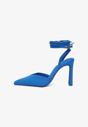 Blue high-heeled shoe with a pointed toe, smooth synthetic material, ankle wrap strap, and a solid block heel.