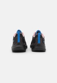 Black athletic shoes with a breathable mesh upper, pink accents, blue heel tab, and a textured rubber sole. Rear view.