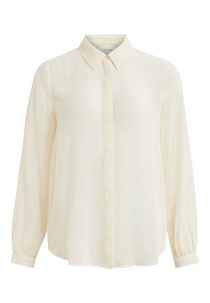 Bluzka kremowa z długim rękawem, subtelną kropkowaną fakturą, mankietami zapinanymi na guziki i ukrytym zapięciem na guziki z przodu.