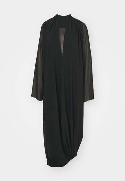 Black garment with a loose, draped design, featuring sheer long sleeves and a deep V-neck. Soft texture, minimal detailing, and no fastenings.