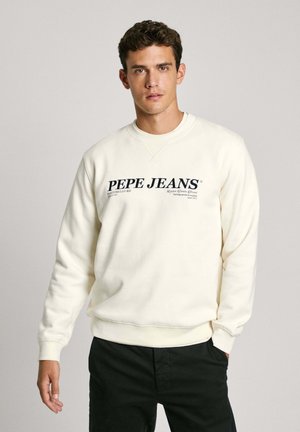 Sweatshirt crème avec un col rond, présentant un grand logo noir "PEPE JEANS" sur la poitrine et des poignets et un bas côtelés.