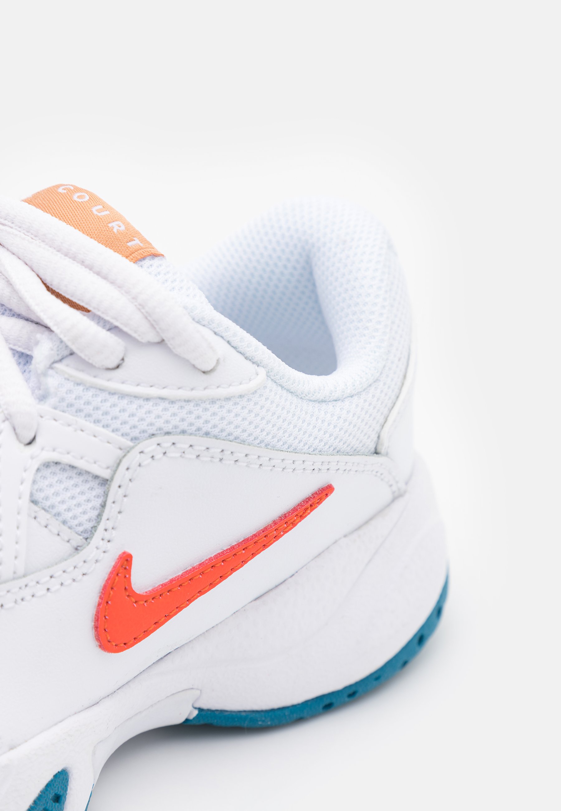 orange and green tennis shoes