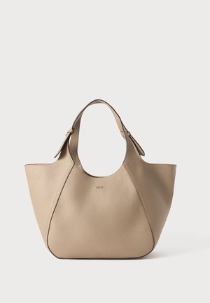 Beige leather tote bag with a structured shape, wide opening, and short handles. Features subtle stitching and a debossed logo on the front.