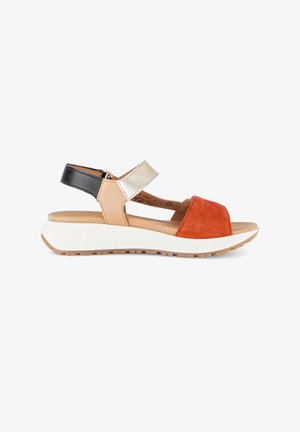 Women's sporty sandal with multi-colored straps in black, beige, metallic silver, and rust orange on a white textured sole.