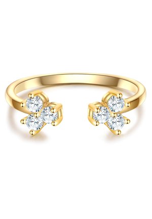 Anello in oro con una fascia liscia che presenta due aggregati di tre gemme trasparenti e rotonde a ciascun estremità, fissate con piccoli ganci.