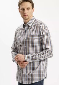 Koszula zapinana na guziki w kratę w kolorze niebieskim, brązowym i białym. Długie rękawy, kołnierz oraz jedna kieszeń na piersi. Mieszanka bawełny.