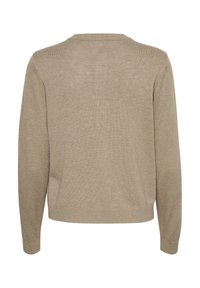 Gaiši smilškrāsas adīts džemperis ar garām piedurknēm, apaļu kakla izgriezumu un ribotām piedurknēm. Tekstūra ir gluda ar nedaudz caurredzamu izskatu.