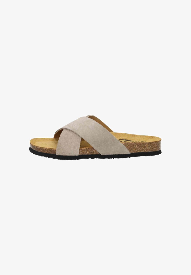 Suede slide sandals in light beige with crossed straps, a cushioned cork footbed, and a black rubber outsole. Flat profile, casual design.
