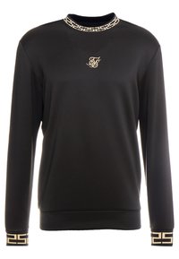 Svart sweatshirt i en slät tygkvalitet, med en dekorativ krage och muddar i guld med ett geometriskt mönster, samt en broderad logotyp på bröstet.