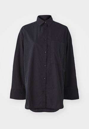 Black button-up shirt made of soft fabric, featuring a classic collar, long sleeves, a chest pocket, and a curved hem design.