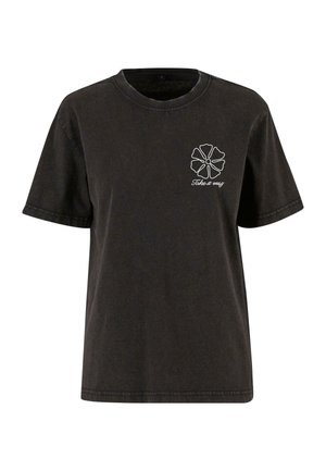 T-shirt in cotone nero con maniche corte, scollatura rotonda e grafica floreale bianca sul petto con la scritta "Take it easy." Vestibilità casual.
