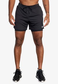 Shorts de bain noirs en tissu léger, dotés d'une ceinture élastique avec cordon de serrage et d'un petit logo sur le côté.