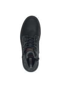 Bottine en cuir noir avec doublure en tissu gris, bout rond, design à lacets et fermeture éclair sur le côté. Présente des accents et des coutures en cuir marron.