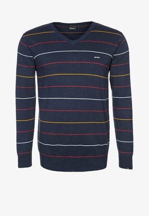 Jersey azul marino con cuello en V, mangas largas y rayas horizontales en blanco, rojo y amarillo mostaza en el cuerpo y las mangas.