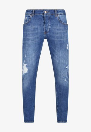 Blugi din denim albastru cu o croială slim, având detalii uzate și petice desfăcute pe coapse. Design clasic cu cinci buzunare și cusături subtile.