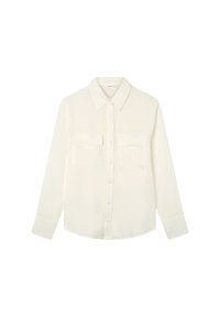 Camicia bianca a maniche lunghe con colletto a punta, due tasche sul petto e un tessuto leggero e morbido. Presenta una vestibilità morbida.