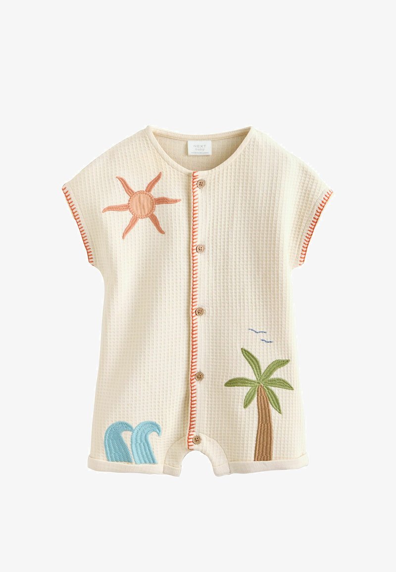 Barboteuse bébé en maille gaufrée crème avec boutons sur le devant, appliqués soleil orange, palmier vert et vague bleue, et bordure orange aux manches et sur le devant.