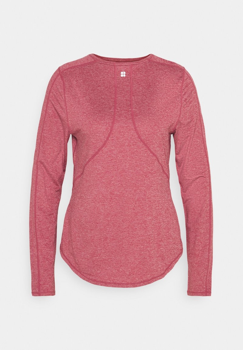 Punainen pitkähihainen urheilu paita, jossa on kevyt, teksturoitu kangas. Ominaisuuksiin kuuluvat kaarevat saumat ja pyöristetty helma rentoa istuvuutta varten.