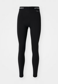 Sorteidrettslig leggings i svart med en tettsittende design og elastisk midjebånd med "TERREX"-merke. Laget av et glatt, elastisk materiale.