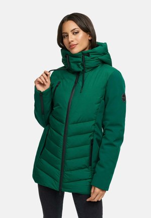 Green padded jacket with a high collar and drawstring hood. Features black zippers and a patch logo on the sleeve. Textured quilted design.