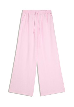 Pantalon large rose clair avec taille élastique et cordon, avec poches latérales, présenté sur fond blanc.