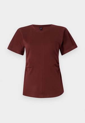 Burgunderfarbenes Kurzarm-T-Shirt aus weicher Baumwolle. Verfügt über einen Rundhalsausschnitt und subtile seitliche Raffungen für eine zusätzliche Form. Glatte Textur.