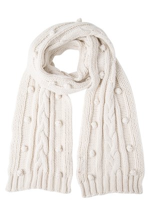 Cream-colored knitted scarf with cable patterns and raised bobble details, folded in a loop.