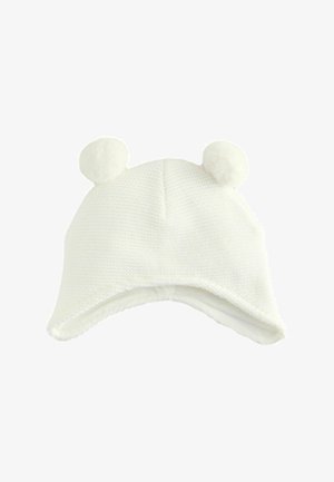 Weiße Strickmütze mit zwei runden Pompoms oben, weicher Innenfutter und einem gebogenen Schirmdesign. Strukturiertes Material mit einem gemütlichen Erscheinungsbild.