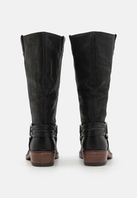 Black leather and suede knee-high boots with a rounded toe, flat wooden heel, and side buckles. Textured finish with distinct stitching.