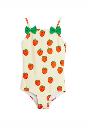 Kremowy strój kąpielowy dla dziecka z pomarańczowym wzorem truskawek, zielonymi detalami liści i dwoma zielonymi kokardkami na ramiączkach.