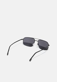 Metal rectangular sunglasses with dark tinted lenses and thin black frames. Features a subtle silver accent near the hinges.