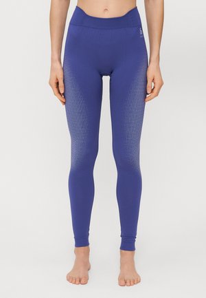 Violet sportinės leggins su aukštu liemeniu, tekstūruotu raštu, sudarytu iš mažų taškelių šoninėse dalyse, ir siaurėjančiais anklių kraštais.