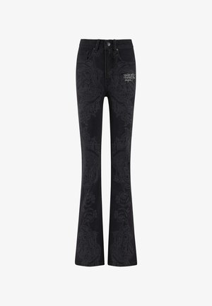 Schwarze, ausgestellte Jeans mit kunstvollen, tonalen Paisley-Mustern. Verfügt über einen Knopfverschluss, Fronttaschen und ein Logo an der oberen linken Oberschenkelseite.