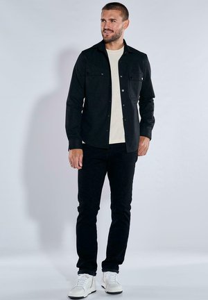 UNI - Shirt - schwarz