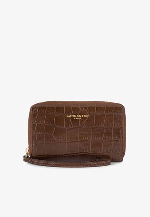 Brown textured wallet made of glossy material featuring a crocodile pattern, with a gold "Lancaster Paris" logo and a wrist strap.