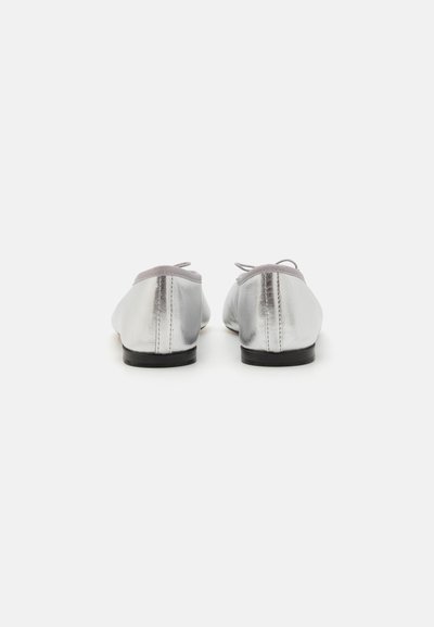 Silver ballet flats with a shiny metallic finish, rounded toes, grey accents, and a low black sole; features laces at the front.
